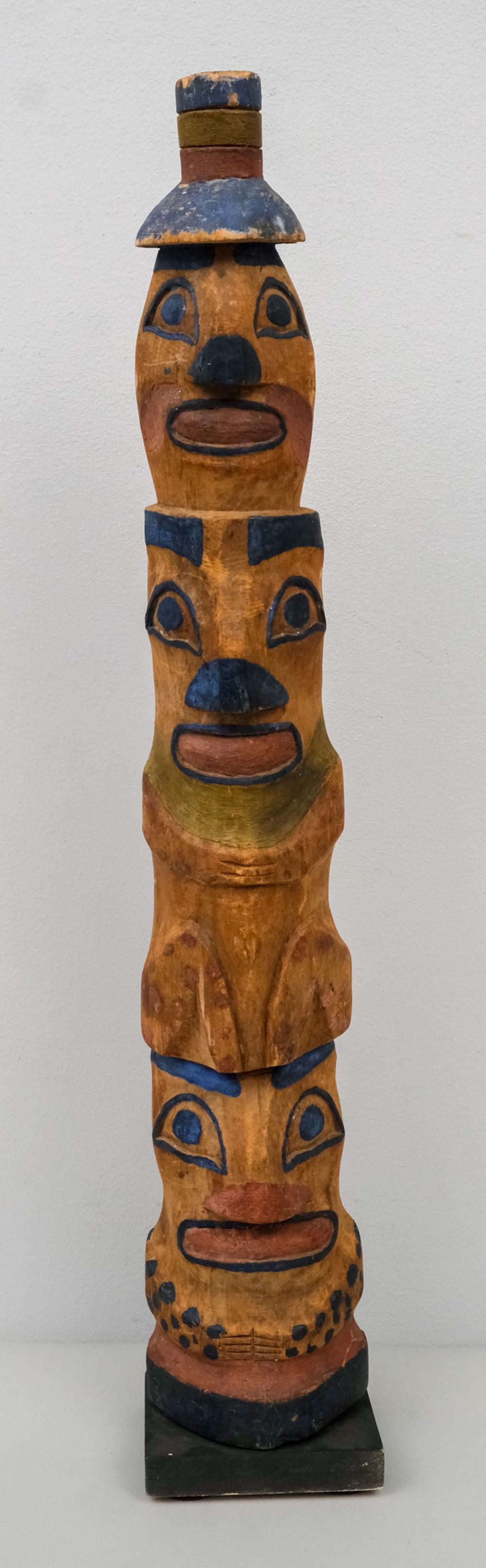 Carved Pacific Northwest Wooden Totem on Stand: Haida style three form totem in polychromed wood. On later stand. 24 1/2".