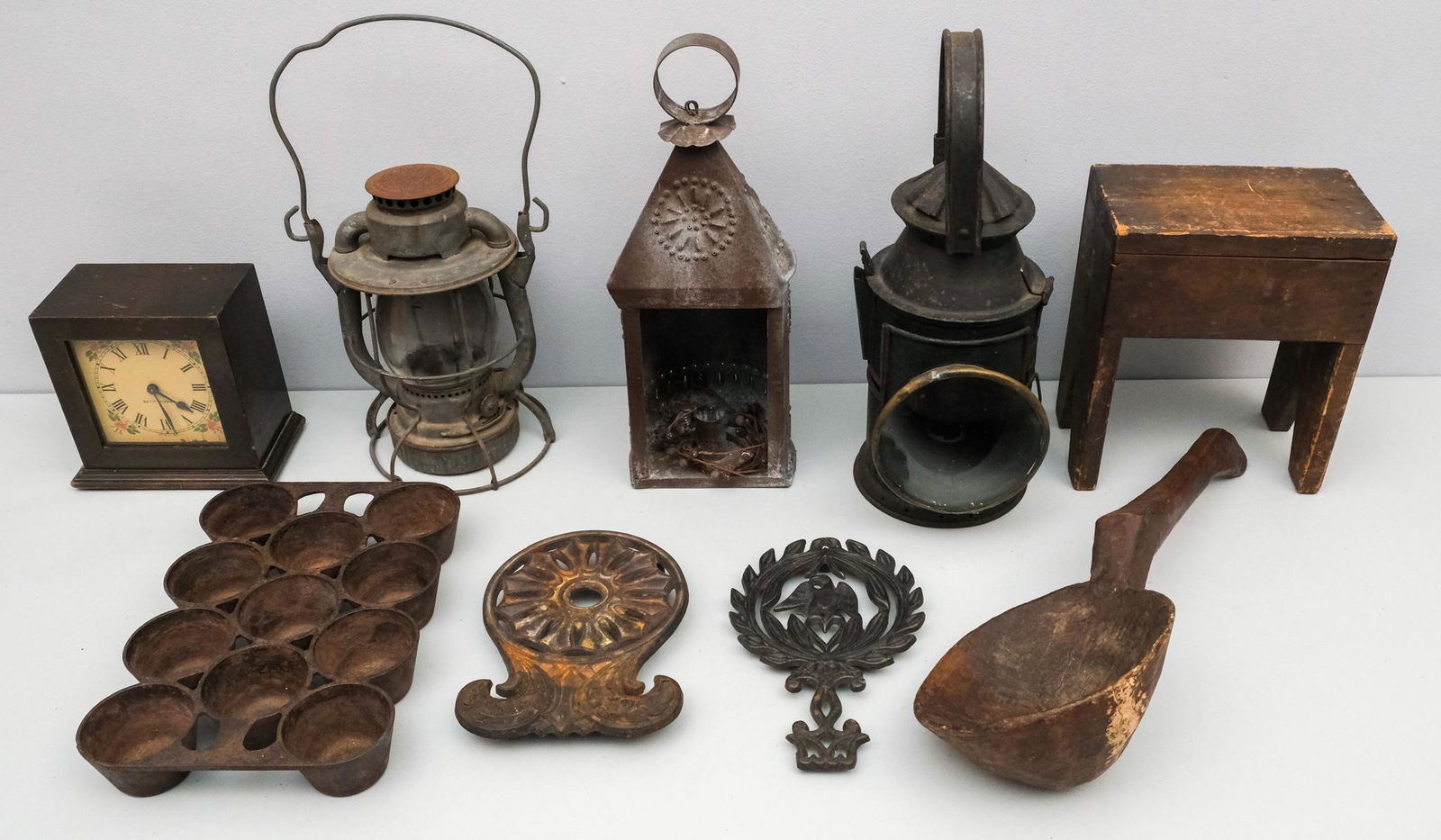 Lot of Country & Primitive Antiques: Including three lanterns, pop-over pan (muffin pan?), carved wooden spoon, Small Stool, and more.