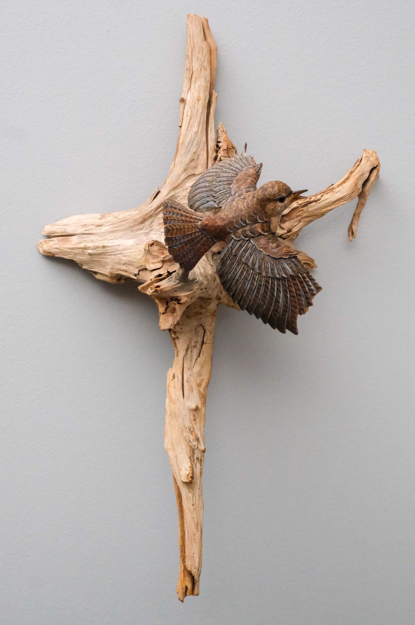 David Sabol Woodcarved Wall Sculpture: Depicting a sparrow perched upon a branch, by the famed woodcarver and instructor David Sabol. 18 1/4".