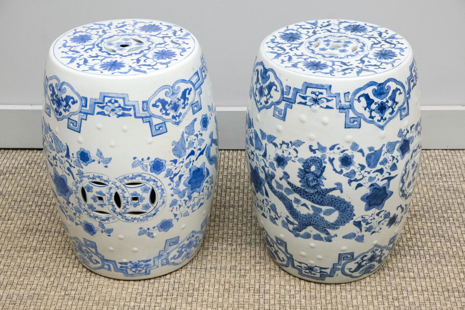 Pair of Blue & White Garden Seats: Pair of Chinese blue and white porcelain garden seats decorated with dragon and bird, 18 1/2" H x 12 1/2" diameter.