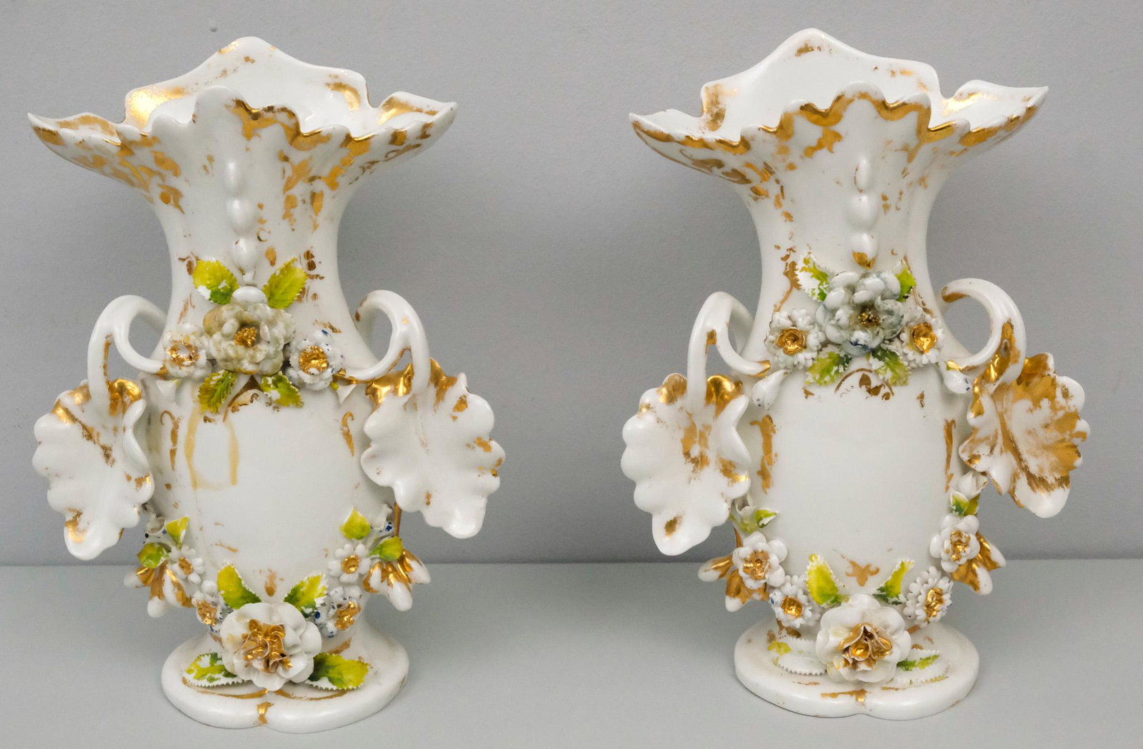 Pair of Old Paris Porcelain Garniture Vases: Scrolling leaves and flowers covered in gold. 11 1/4".