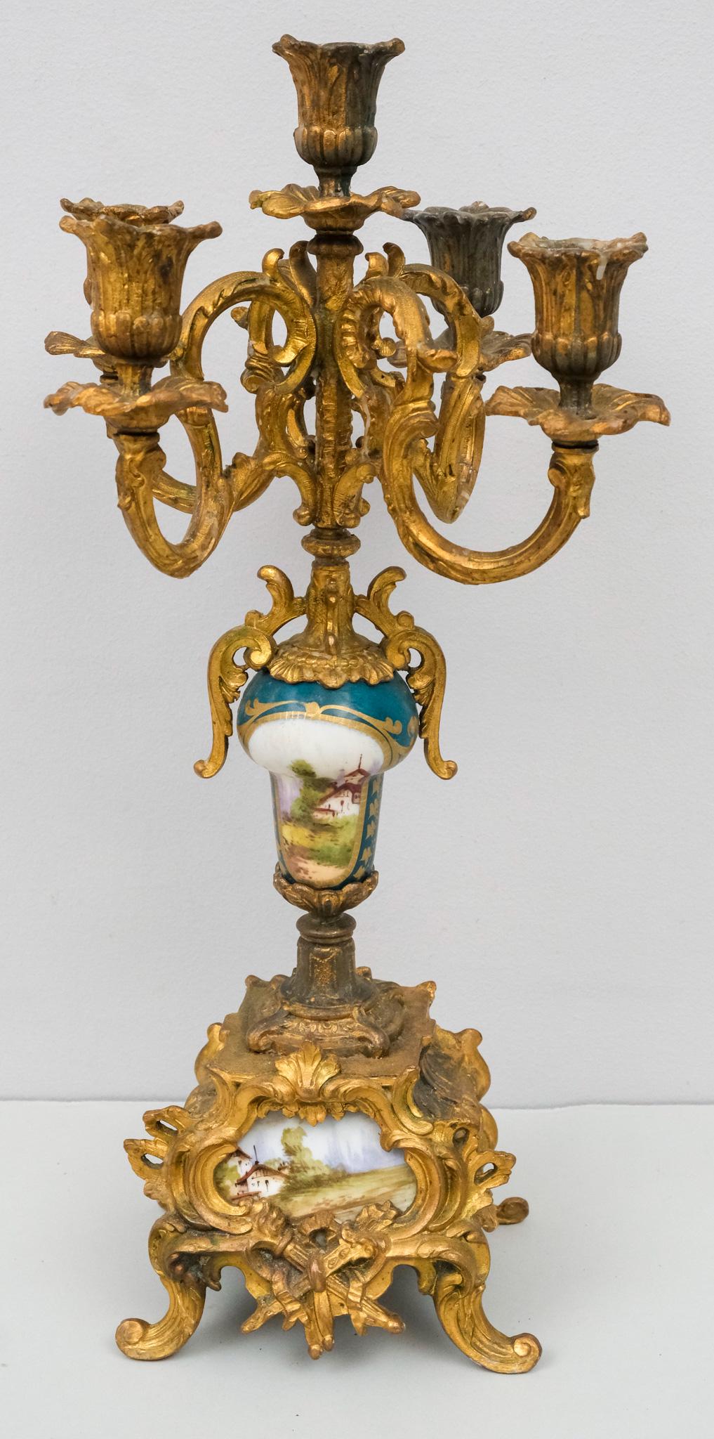 Gilt Metal & Painted Porcelain Candelabra: Ornate 5 arm candelabra with painted landscape scenes. 10" x 18".
