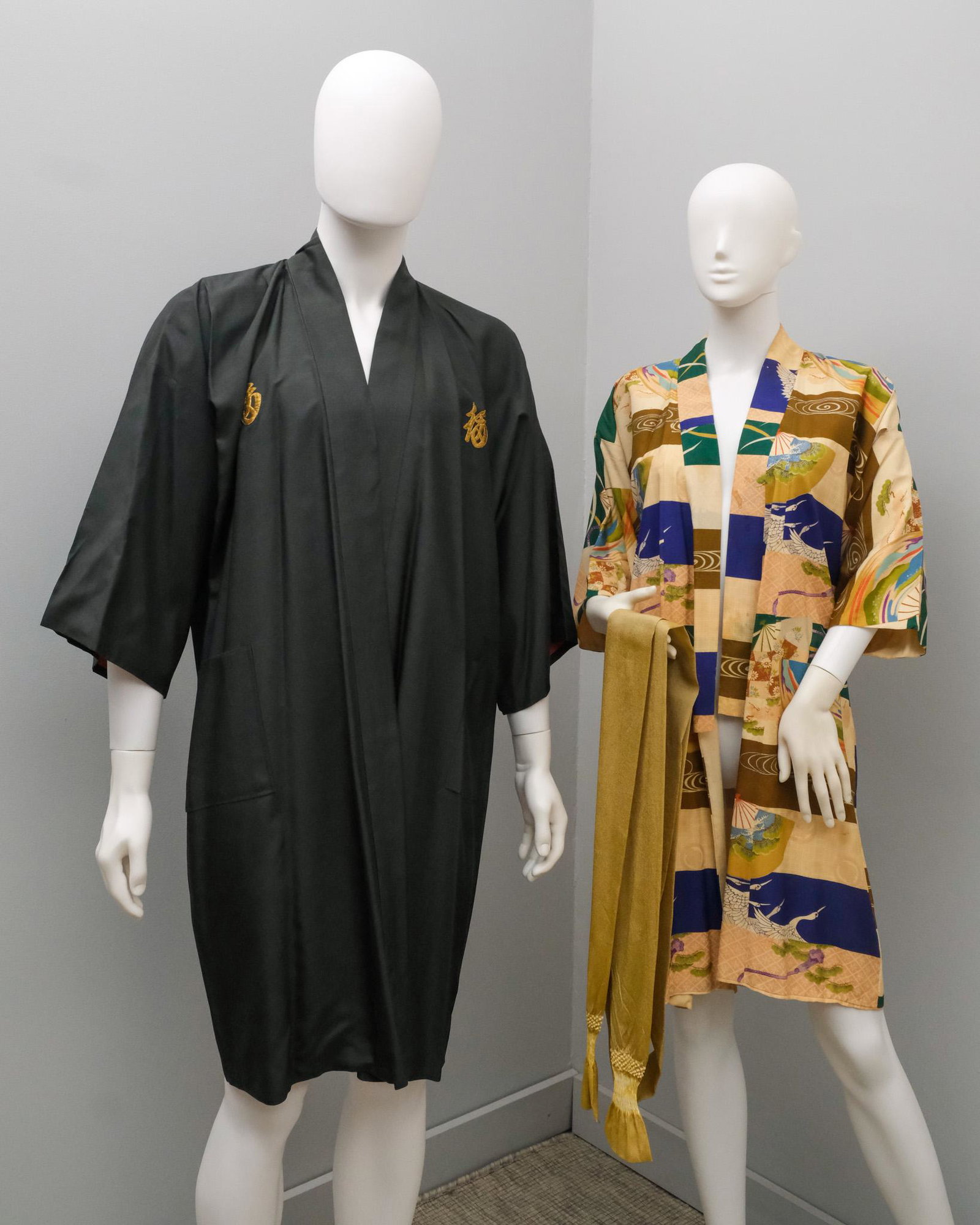 2 Vintage Kimonos & an Obiage: One with black field and gold thread. Hanging length of kimonos 40" and 43".