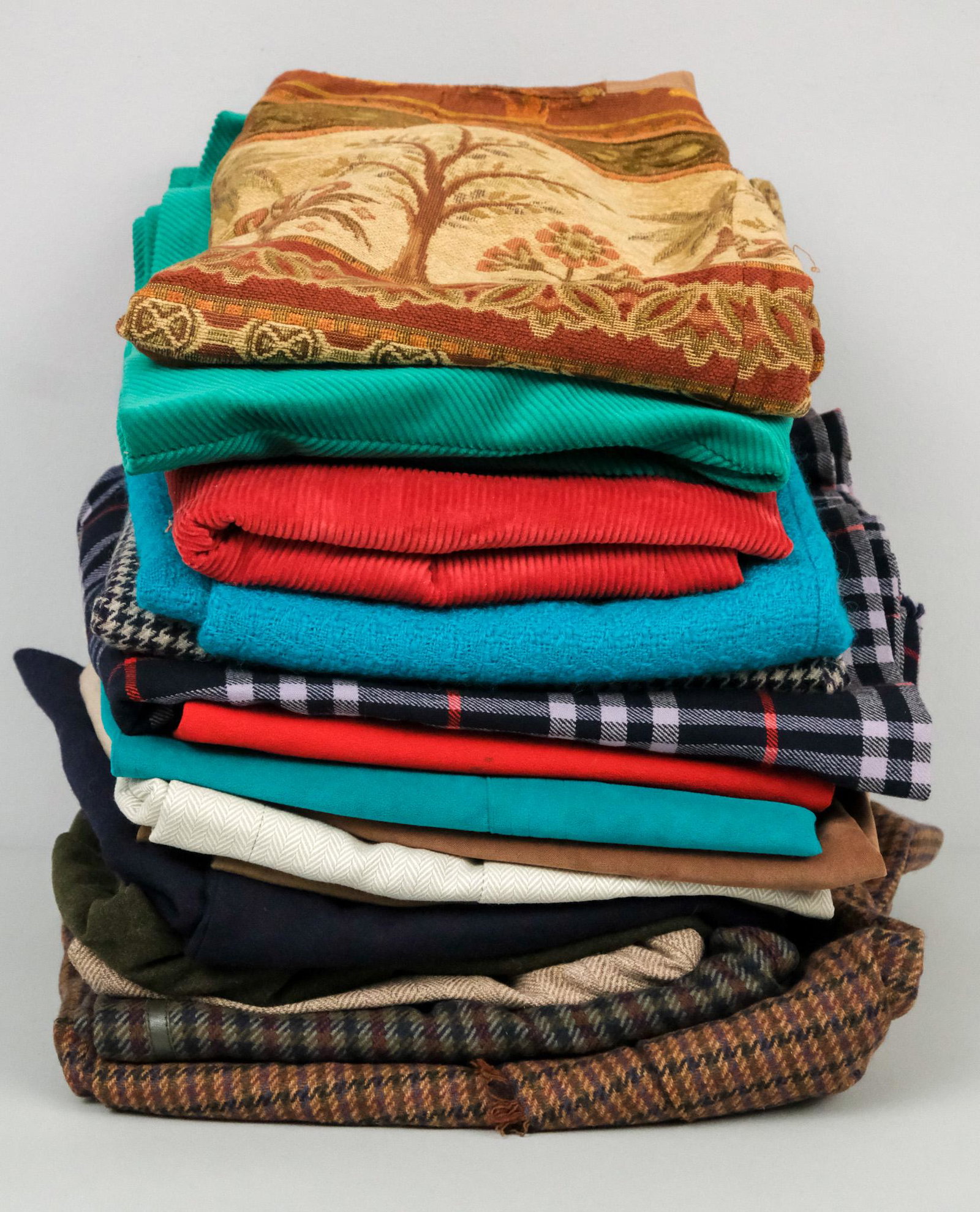 Lot of 16 Women's Skirts: Large amount of women's skirts, some unlabeled or un-sized. Lot includes: 1) A-line, green corduroy, size 8, 28 1/2" in length, Ah! Austin Hill 2) elephant tapestry pencil skirt, size 12, 23", J. McLa