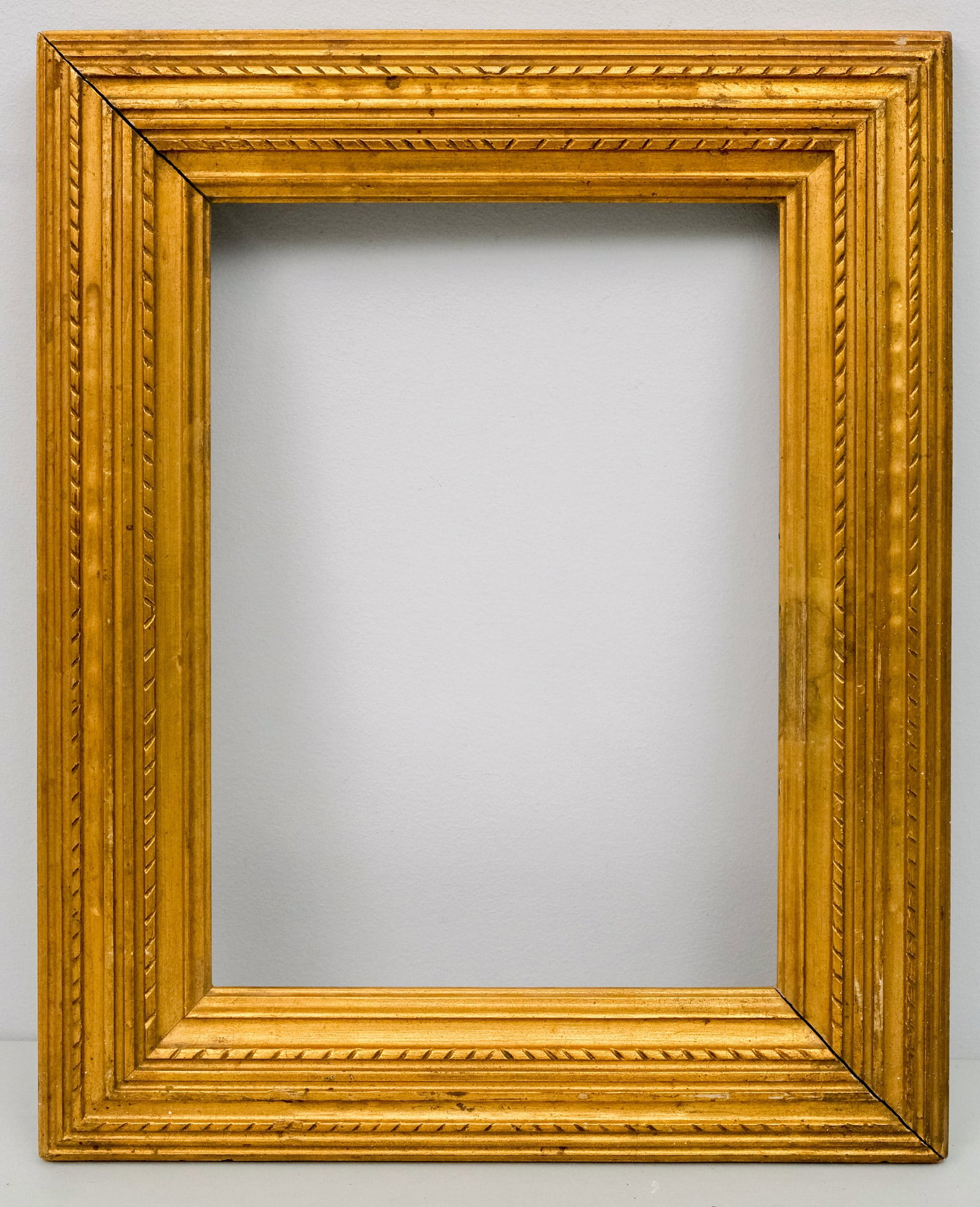 Stanford White Gilt Frame 10" x 14": American, ca. 1900, possibly made by Newcomb Macklin, having alternating rows of repeating rope twist, small cavetto, and linear ornament. Rabbet 10" x 14", Overall 15 3/4" x 19 1/2", Molding 3".