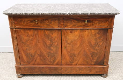 Antique French Stone Top Sideboard: French, 19th century stone top sideboard with two drawers over a cabinet space, rounded corners, veneer surface, squash bun feet, 36" H x 52 1/2" W x 22 1/2" L.