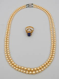 10K & Diamond Strand of Pearls & an Egyptian Ring: The pearls with diamond accent clasp. The ring with lapis scarab, testing at 18K or better. Weight of ring 3.0 dwt.