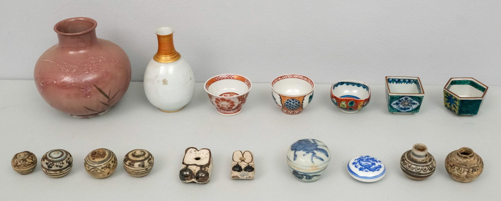Lot of Small Asian Antiques & Decorative Objects: Including Japanese sake cups, early Vietnamese covered boxes, and more. Tallest vase 5".