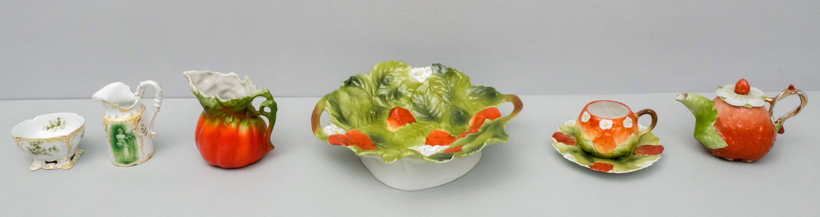 Lot of Bayreuth Style & Rosenthal Porcelain: Comprising a neoclassical style sugar and creamer by Rosenthal together with many strawberry articles. Strawberry dish 9" across.