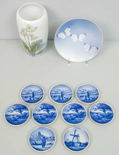 Group of Danish Porcelain: Comprising a (9) Bing & Grondahl miniature collector plates, a Royal Copenhagen plate with butterflies, and a Royal Copenhagen vase. Vase 7 1/2".