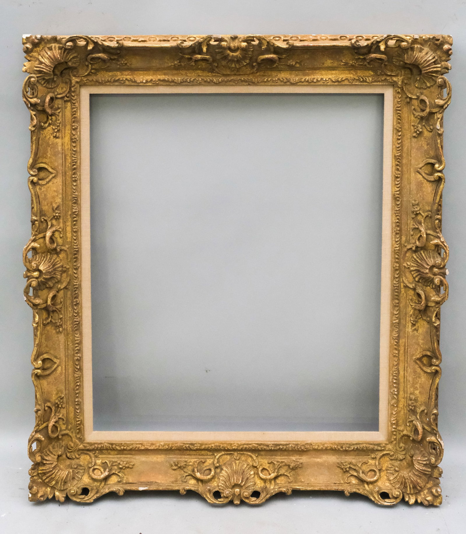 Louis XIV Giltwood Frame 25" x 30": American, 20th century, a very finely wrought custom Louis XIV style carved frame, in a great standard size. Overall 34 1/4" x 40", Rabbet 25" x 30", Molding 5".