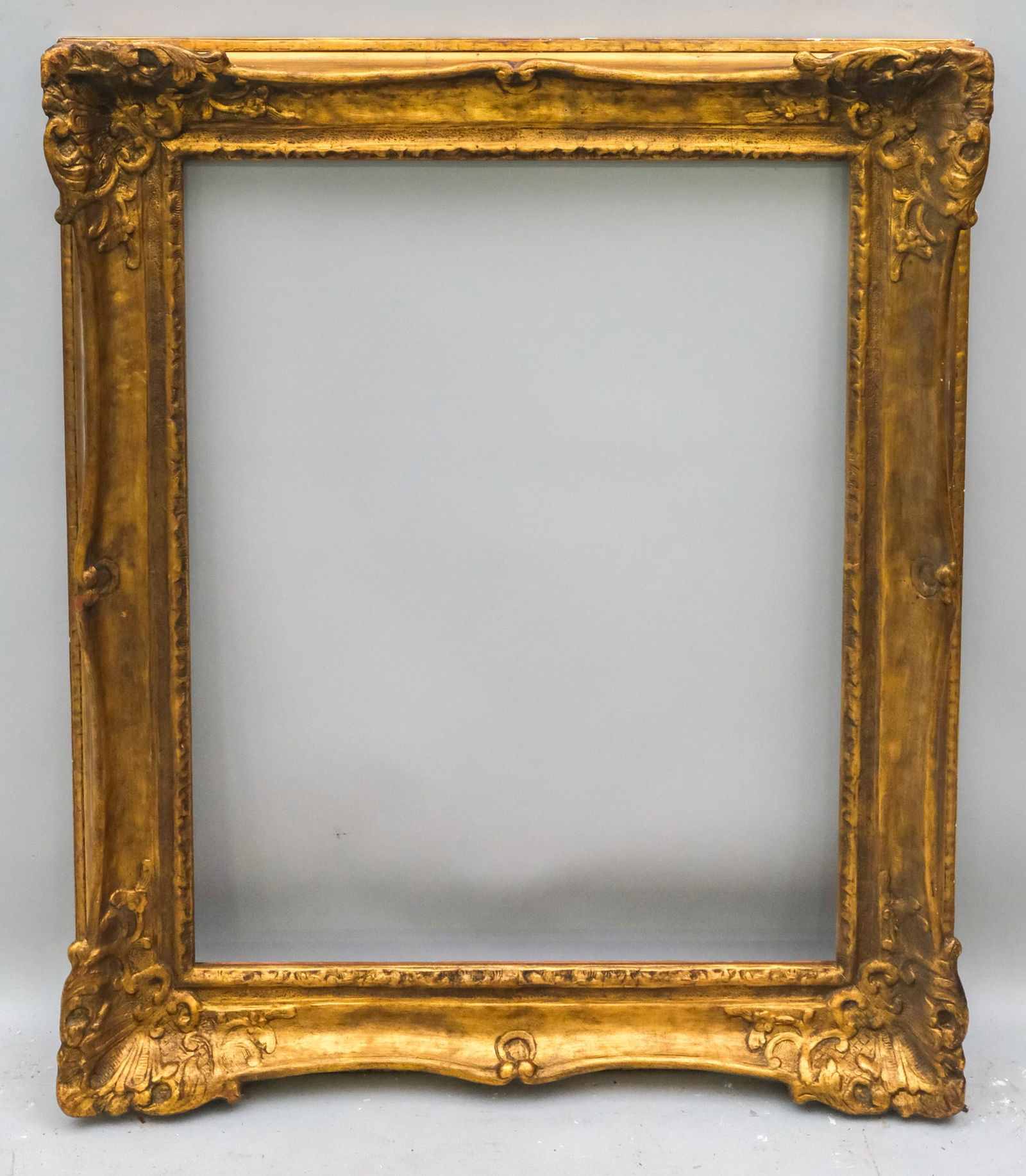Louis XIV Giltwood Frame 25" x 32": American, ca. 1930, gilded frame in the French style, likely by Newcomb Macklin. Overall 33 1/2" x 40 1/2", Rabbet 25" x 32", Molding 4 1/2".
