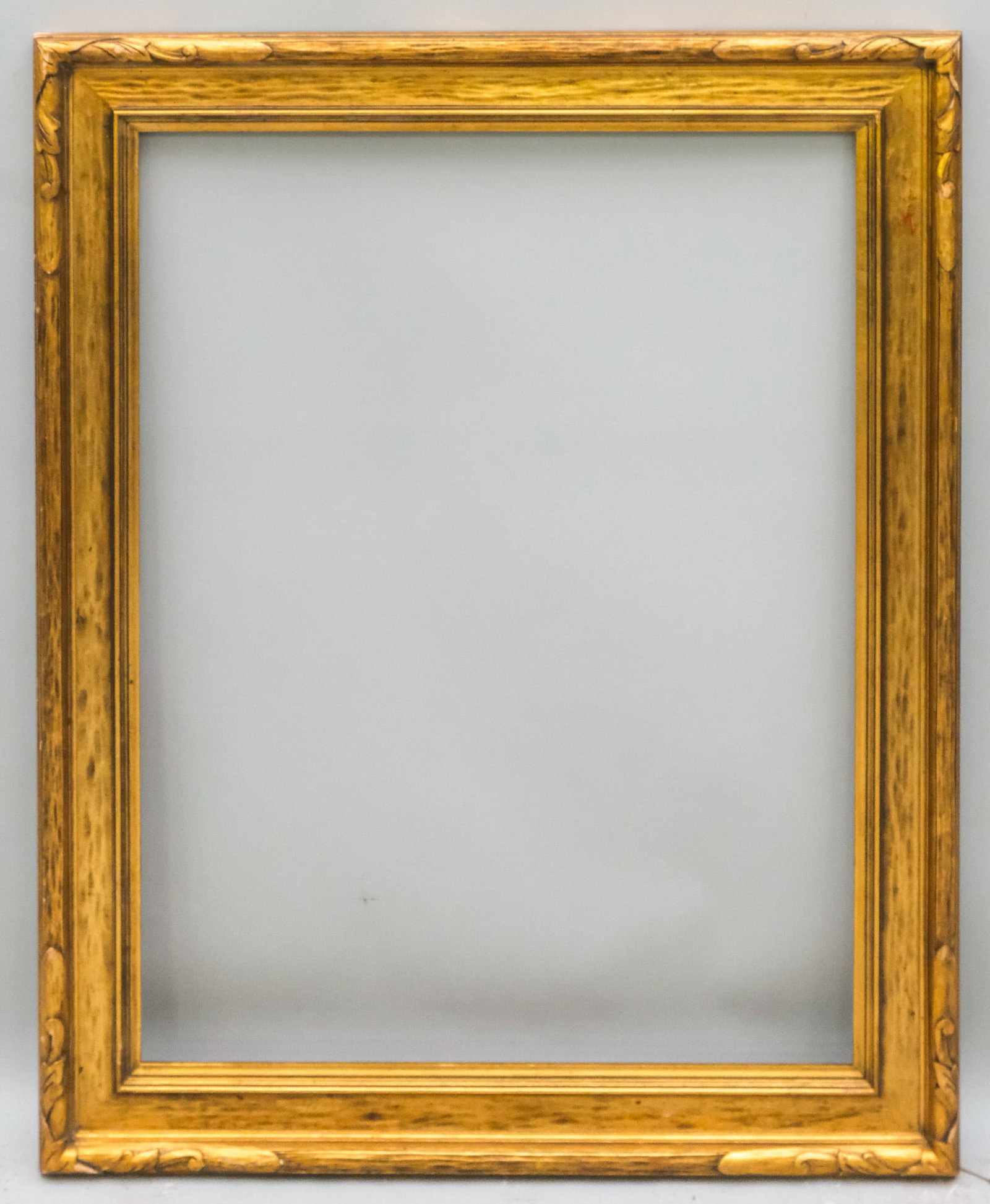 American Arts & Crafts Gilt Frame 24" x 32": American, ca. 1920, carved and gilded having cassetta form. Overall 30" x 38 1/4", Rabbet 24" x 32", Molding 3 1/4".