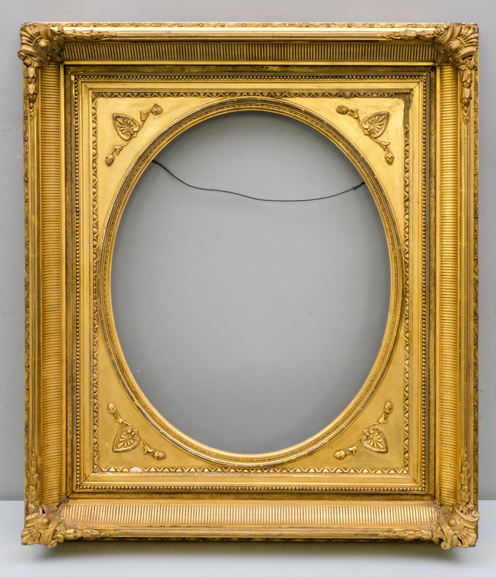 Hudson River School Gilt Frame 20" x 24 1/4": American, ca. 1870, having fluted cove and removable oval spandrel. Overall 28" x 32 1/2", Rabbet 20" x 24 1/4", Molding 4 1/2".