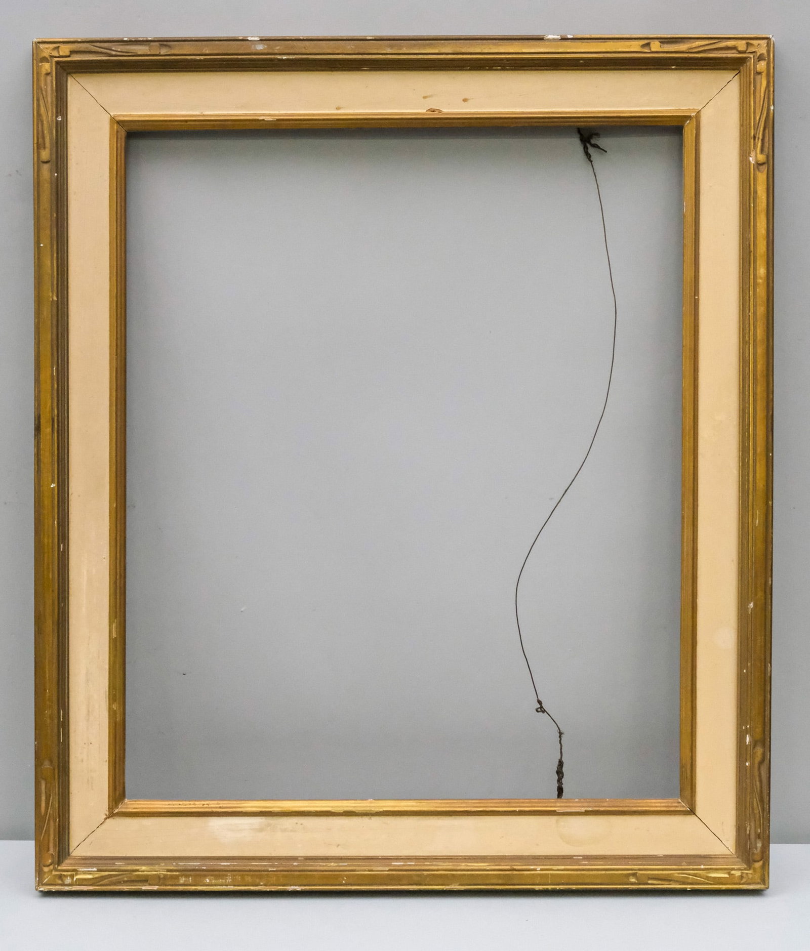 American Arts & Crafts Gilt Frame 20" x 24": American, ca. 1920, having cassetta profile and painted panel, in a great standard size. Overall 25 3/4" x 30", Rabbet 20" x 24", Molding 3 1/4".