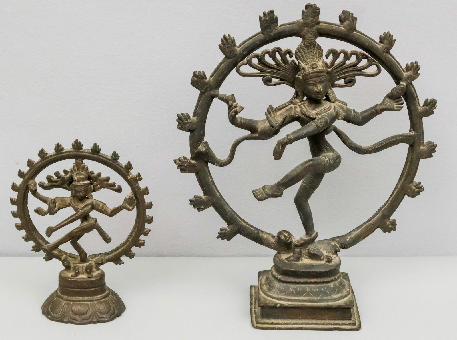 Two Antique Hindi Indian Bronzes of Shiva: Two graduated sized sculptures of Shiva in the Nataraja pose. Largest 9 1/4".