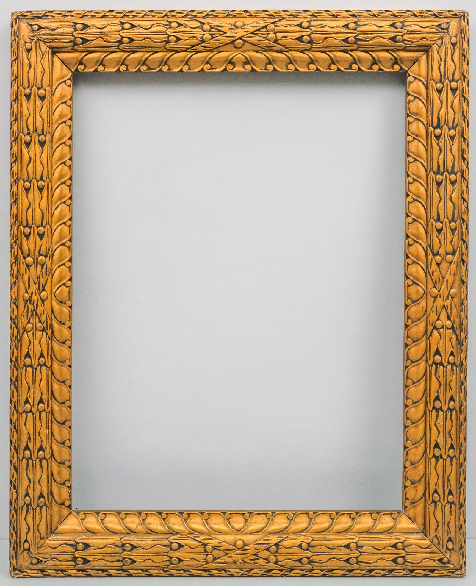 American Arts & Crafts Gilt Frame 22" x 28 3/4": American, ca. 1910, having stylied laurel and berry motif. Overall 29 1/4" x 36", Rabbet 22" x 28 3/4", Molding 4".