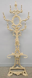 American Cast Iron Hall Tree: American, 19th century cast iron hall tree in two pieces with six curved hooks over an umbrella stand, 27" X 8" X 74" overall.