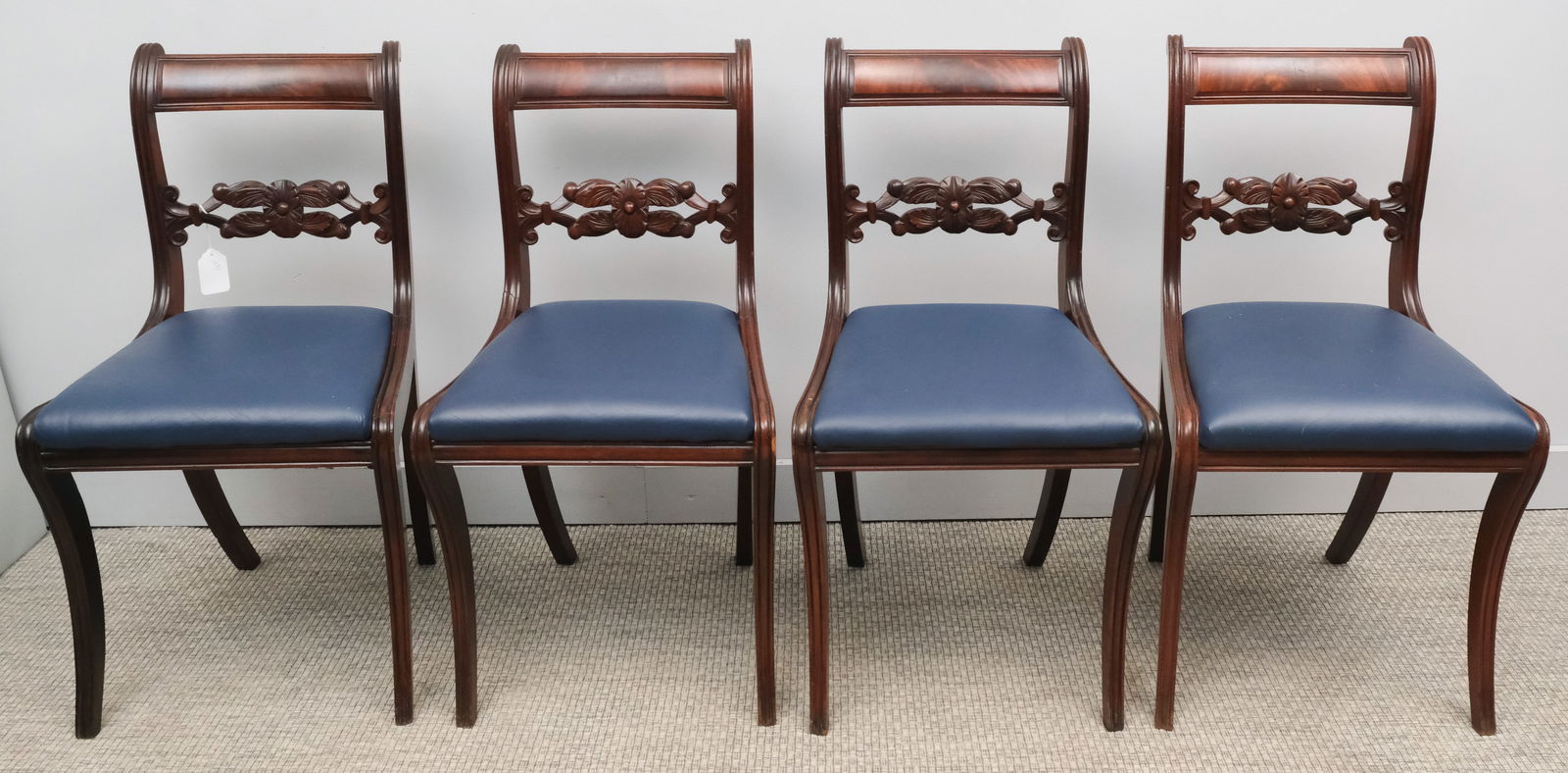 Group of Federal Style Dining Chairs: Group of four 19th century Federal style dining chairs with carved, foliate back splats, reupholstered in blue leather, 18" X 20" X 35".