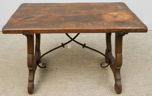 Spanish Baroque Trestle Table: 19th century Spanish Baroque style oak trestle table with iron stretchers, 25 1/2" x 37 1/2" x 21 1/2".