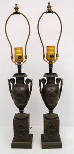 Pair of Neoclassical Urn Lamps: Pair of early 20th century patinated bronze Neoclassical urn form lamps, 22" x 3 1/4" x 3 1/4".