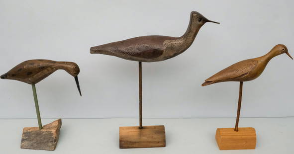 Three Antique Carved Shore Bird Decoys: Three carved and painted shore birds, two with glass eyes. Tallest on stand 17 1/8".