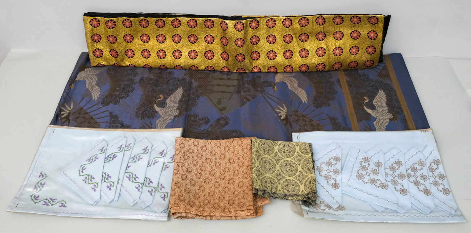 Box of Vintage Textiles & Fabrics: Together with a set of embroidered napkins and placemats.