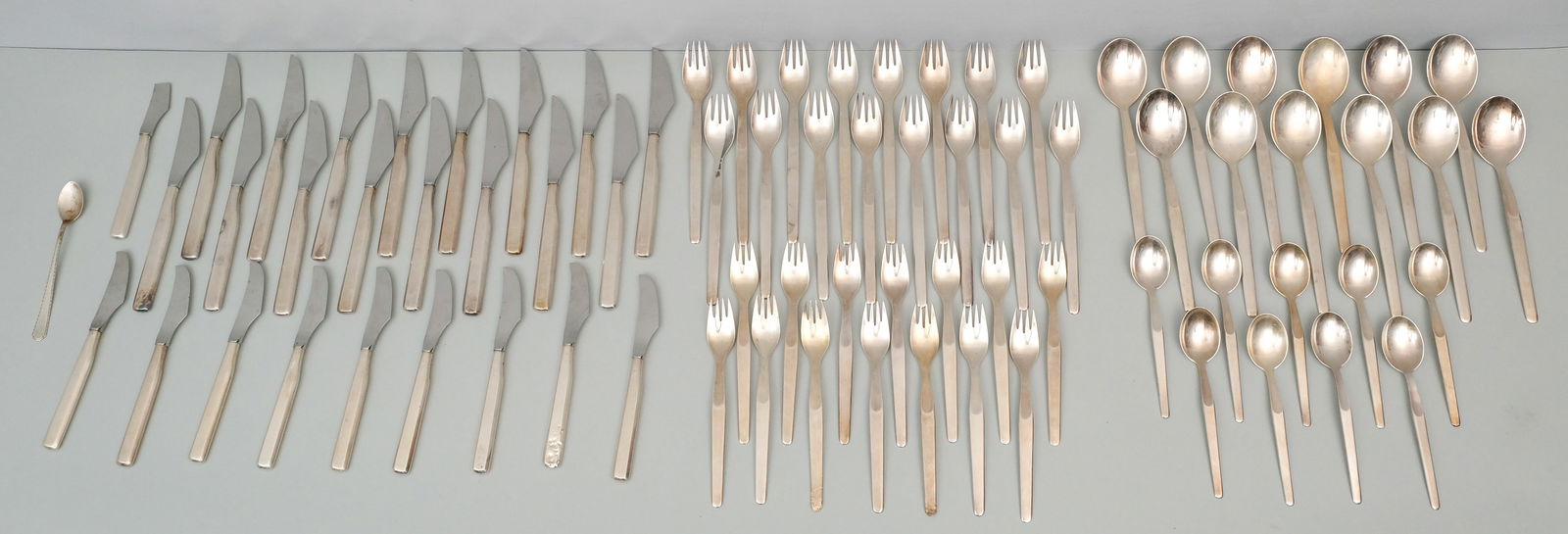 Tapio Wirkkala Silver Marski Flatware Service: Designed by Tappio Wirkkala and manufactured by Kultakeskus Oy in .916 sterling silver. Set comprises: (12) 7 5/8" place soup spoons, (9) 5 3/4" teaspoons, (14) 6 1/2" salad forks (2 with disposal dam