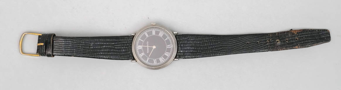 Tiffany Black Face French Wrist Watch: With stylish black leather band, marked as shown, 8 7/8".