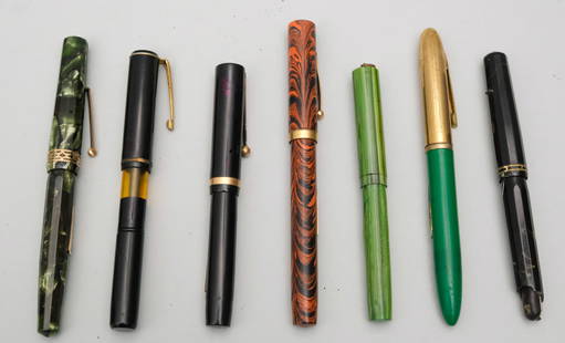 Group of Antique Fountain Pens: Comprising an Eversharp Doric, an Eggens pen with 14K gold nib, another Eversharp Doric (losses), a black Sheaffer (lacking internal elements), a Waterman's #52 red ripple (lacking plunger lever), a T