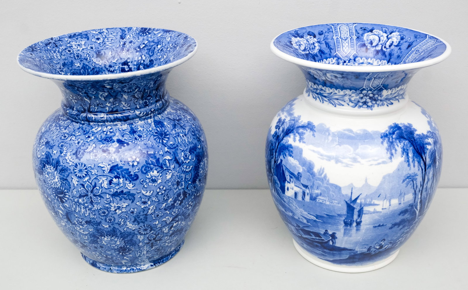 Two Large Blue & White Cauldon Porcelain Vases: Comprising a landscape example by and another in the Siam pattern. 10 1/2".