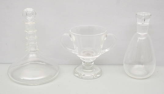 Group of Steuben Glass Table Articles: Comprising a loving cup and two decanters. Marked as shown. Tallest decanter 10 1/4".
