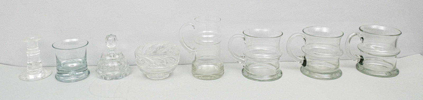 Group of Contemporary Glass: Including a Steuben candlestick with teardrop inclusion and a dolphin bowl by Tiffany & Co.