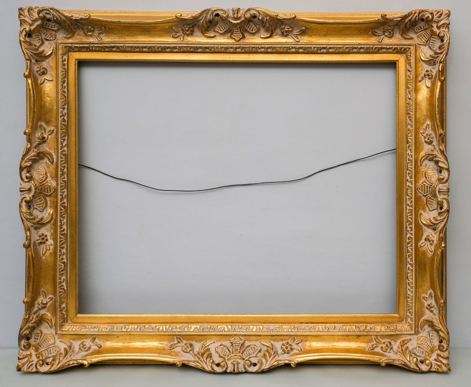 Louis XIV Giltwood Frame 24" x 30": American, 20th century, a custom Louis XIV style carved frame in a great standard size. Overall 32 1/2" x 38 1/2", rabbet 24" x 30", molding 4 1/2".