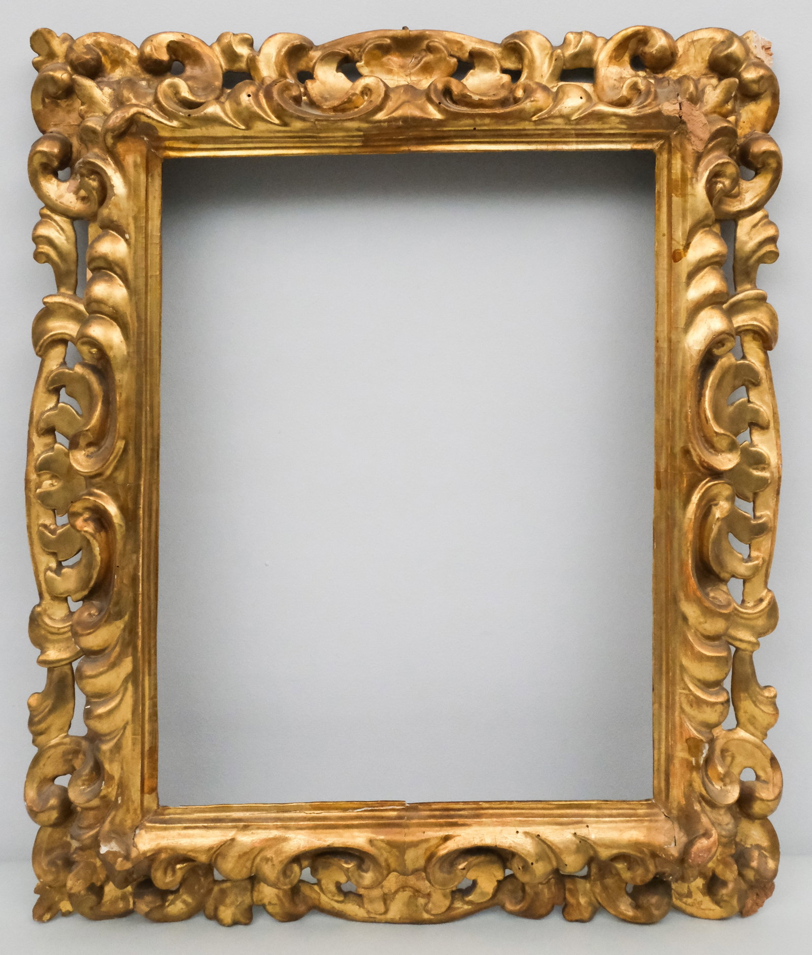 Italian Giltwood Frame 17" x 22": Italian, ca. 1840, likely Florentine, carved and gilded in the Baroque taste. Overall 20 1/2" x 30 1/4", rabbet 17" x 22", molding 5".