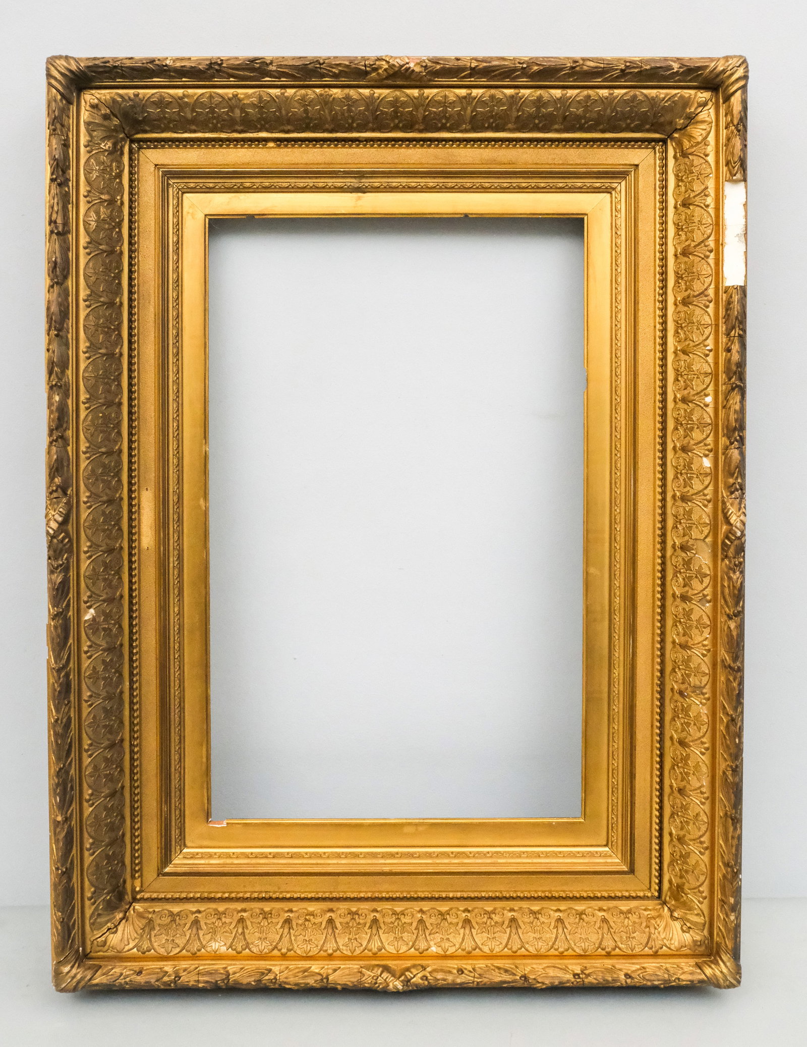 Hudson River School Gilt Frame 15" x 24": American, ca. 1870, having laurel and berry top edge and cushion profile. Overall 26 3/4" x 35 3/4", rabbet 15" x 24", molding 5 1/2".