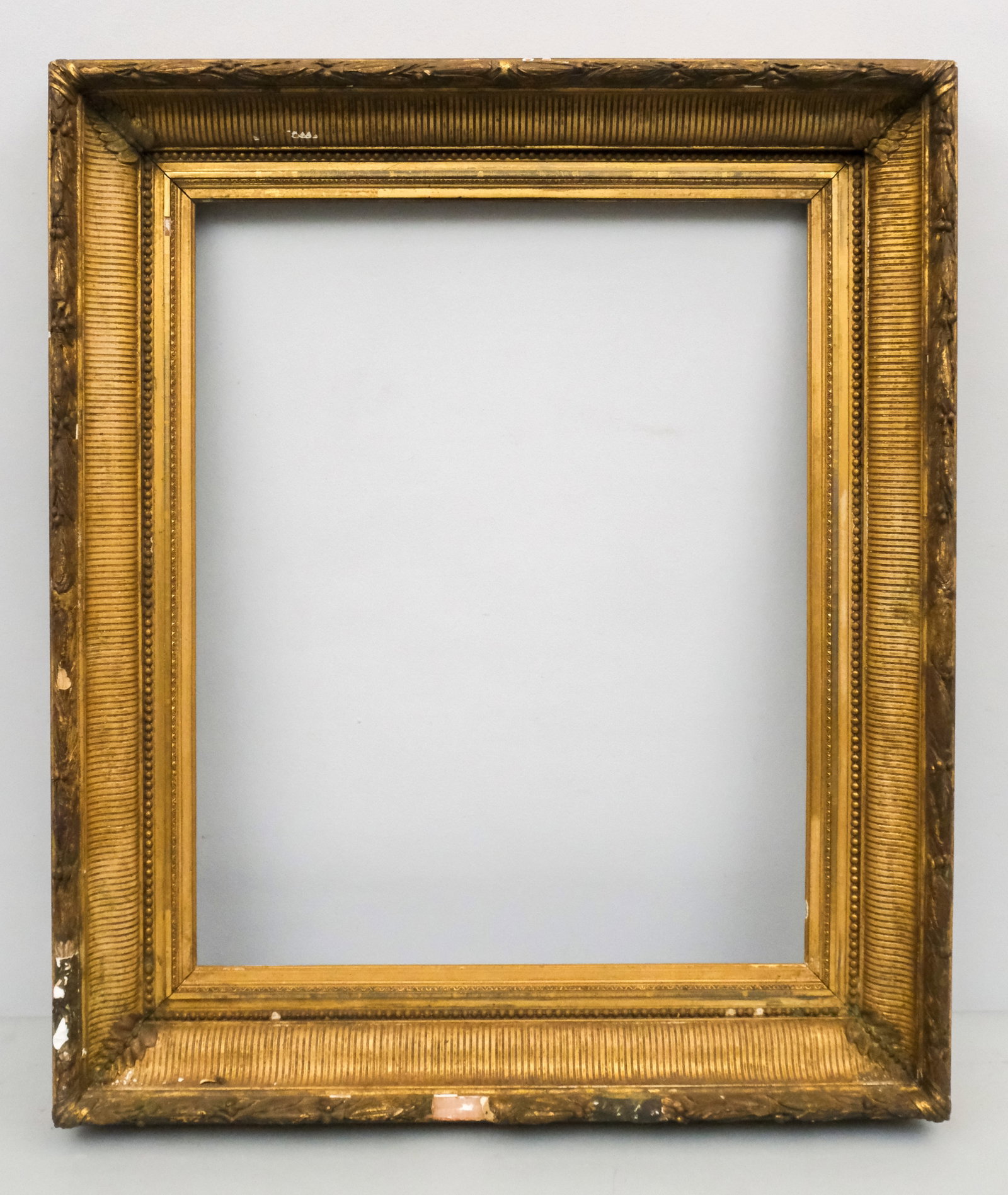 Hudson River School Gilt Frame 20" x 26": American, ca. 1870, having fluted ogee and laurel and berry top edge. Overall 29" x 34", rabbet 20" x 26", molding 4 1/2".