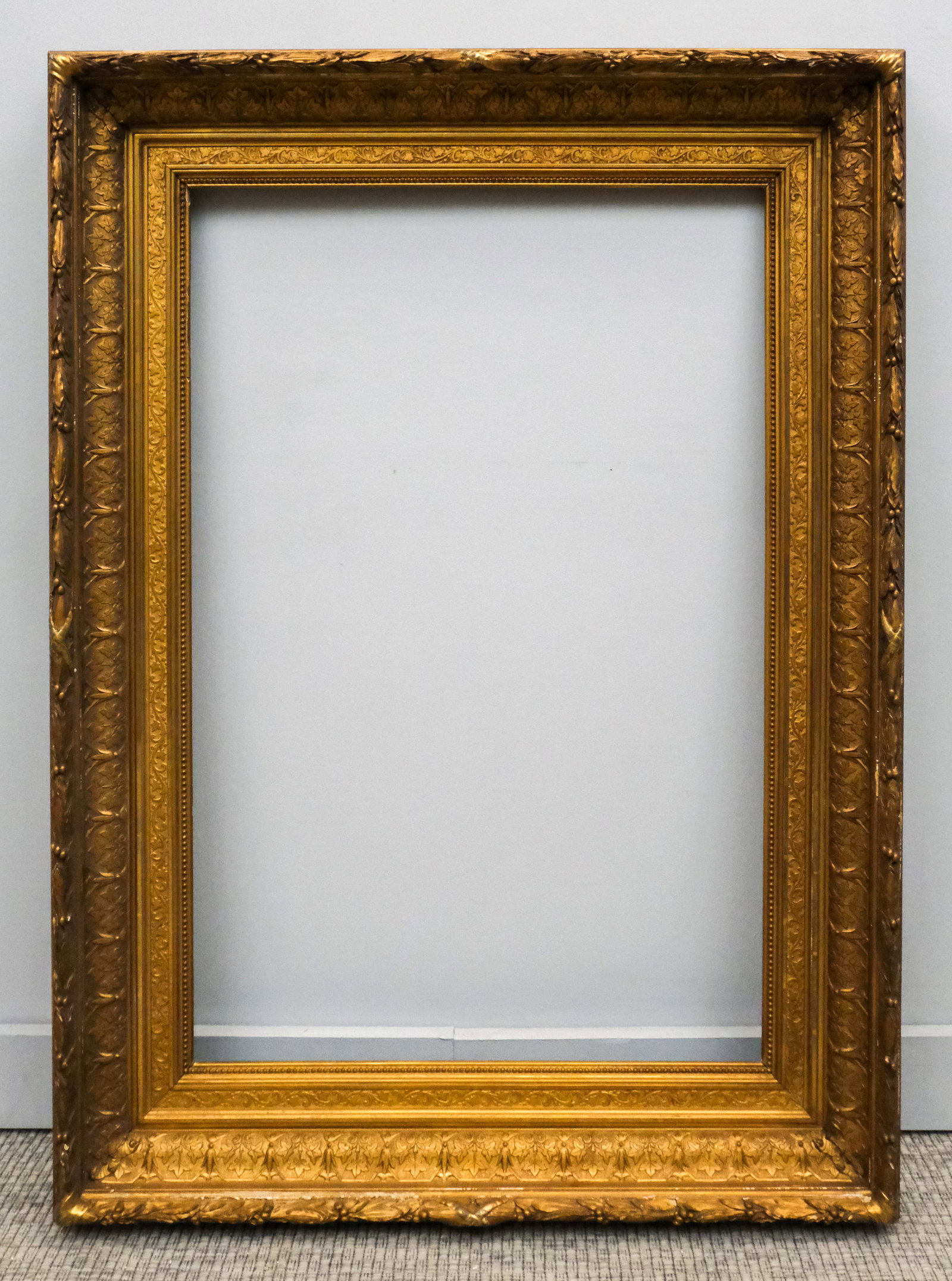 Hudson River School Gilt Frame 23" x 36": American, ca. 1870, having ogee profile with naturalistic motifs. Overall 33 1/4" x 45 3/4", rabbet 23" x 36", molding 5 1/4".