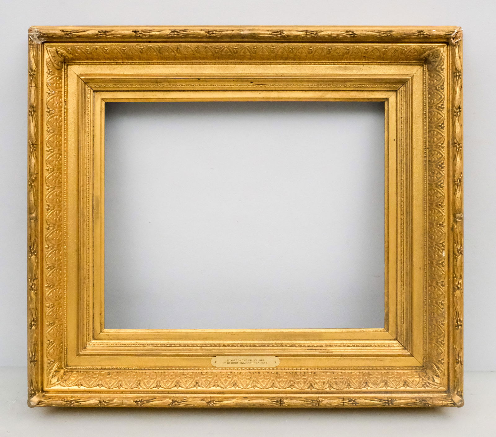 Hudson River School Gilt Frame 15 1/2" x 19": American, ca. 1870, having anthemion cushion profile and laurel and berry top edge, bears name plate for George Inness. Overall 25" x 1/4", rabbet 15 1/2" x 19", molding 5".