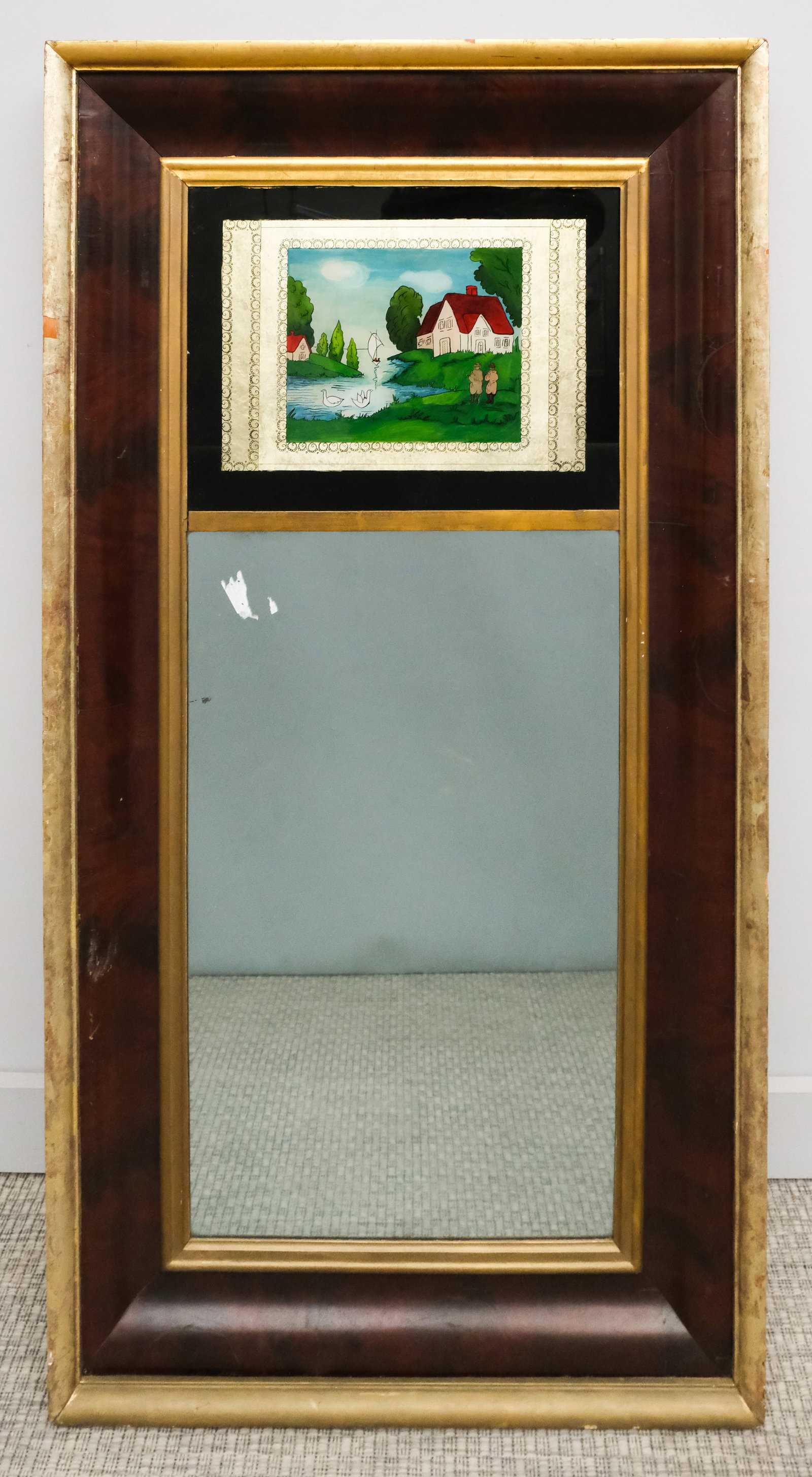 American Empire Mahogany Trumeau Mirror: 19th century American Empire trumeau mirror with mahogany veneer and gilt accents, with "Wilde & Merriam" label verso, 25" x 47 1/2" overall.