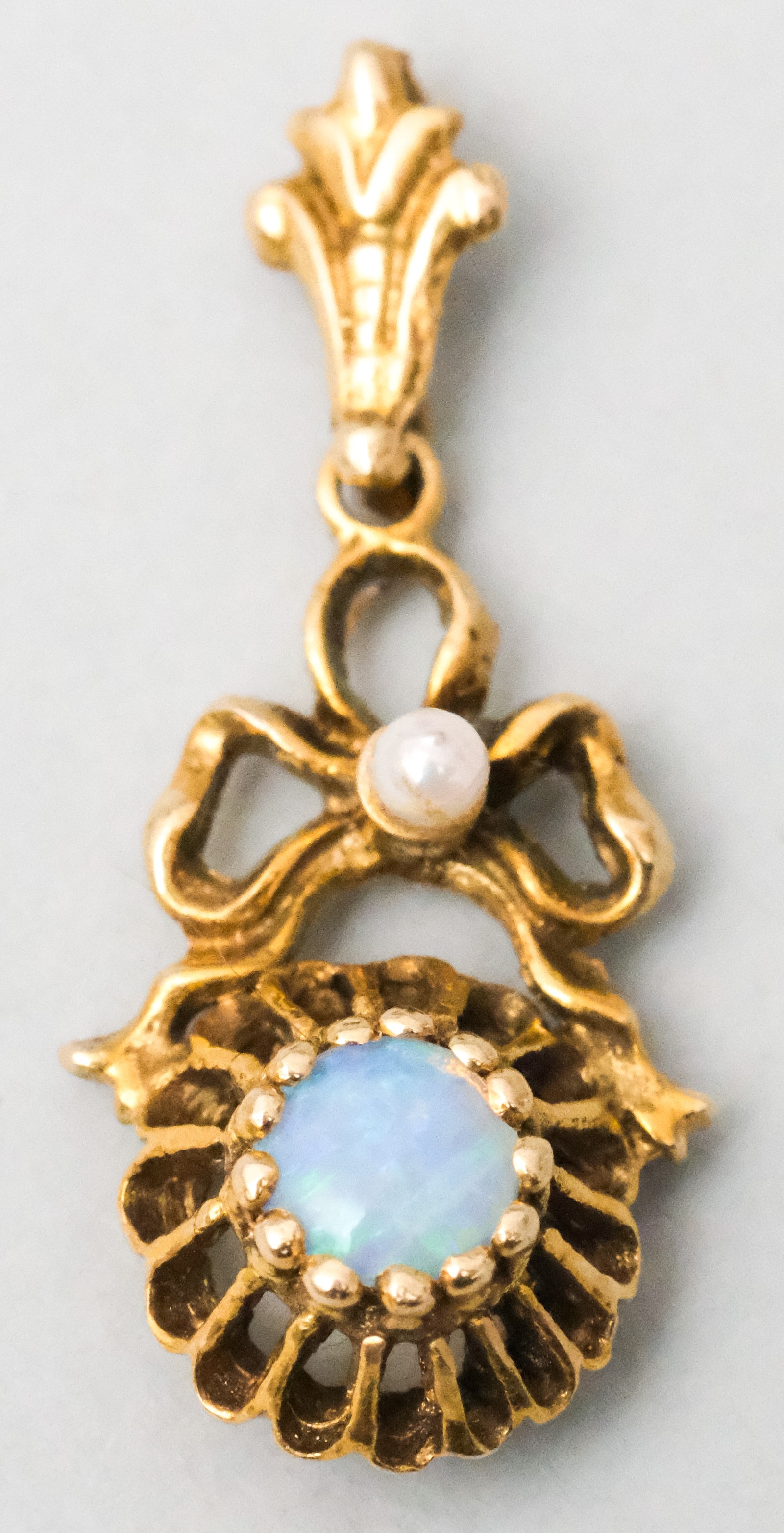 Vintage 14K Gold Opal & Pearl Pendant: Ribbon or bow form pendant. 1 1/4" including bale and 1.7 dwt of 14K.