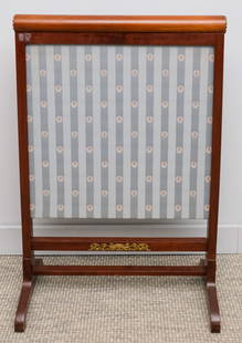 Antique Ernest F. Hagen Mahogany Fire Screen: Late 19th century Ernest F. Hagen mahogany fire screen with removable panel of fabric,, decorated in ormolu rosettes and crest, with paper label "From Ernest F. Hagen Furniture and Antiques" on unders