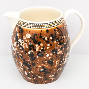 Antique Mochaware Pitcher: Antique mocha decorated pitcher, 7" H x 8" W x 5 3/4" diameter.