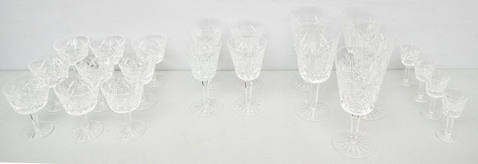Lot of "Clara" Pattern Waterford Glasses: Lot consisting of five large wine glasses (6" H x 3" diameter), nine sherbert or cocktail glasses (4" H x 3" diameter), four small wine glasses (4" H x 3" diameter), and four cordial glasses (3 1/2" H