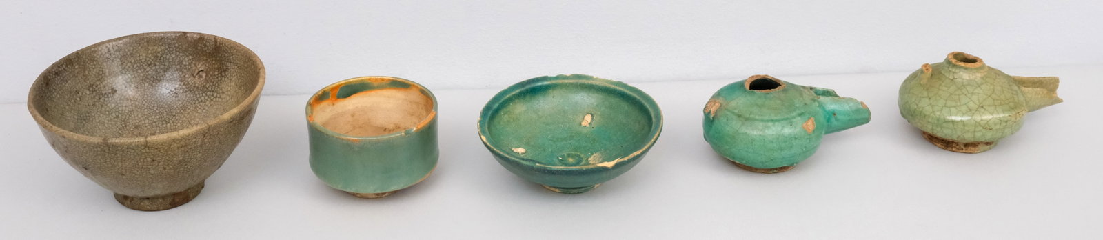 Ancient Chinese & Islamic Pottery Relics: Comprising bowls, lamps, and dishes.