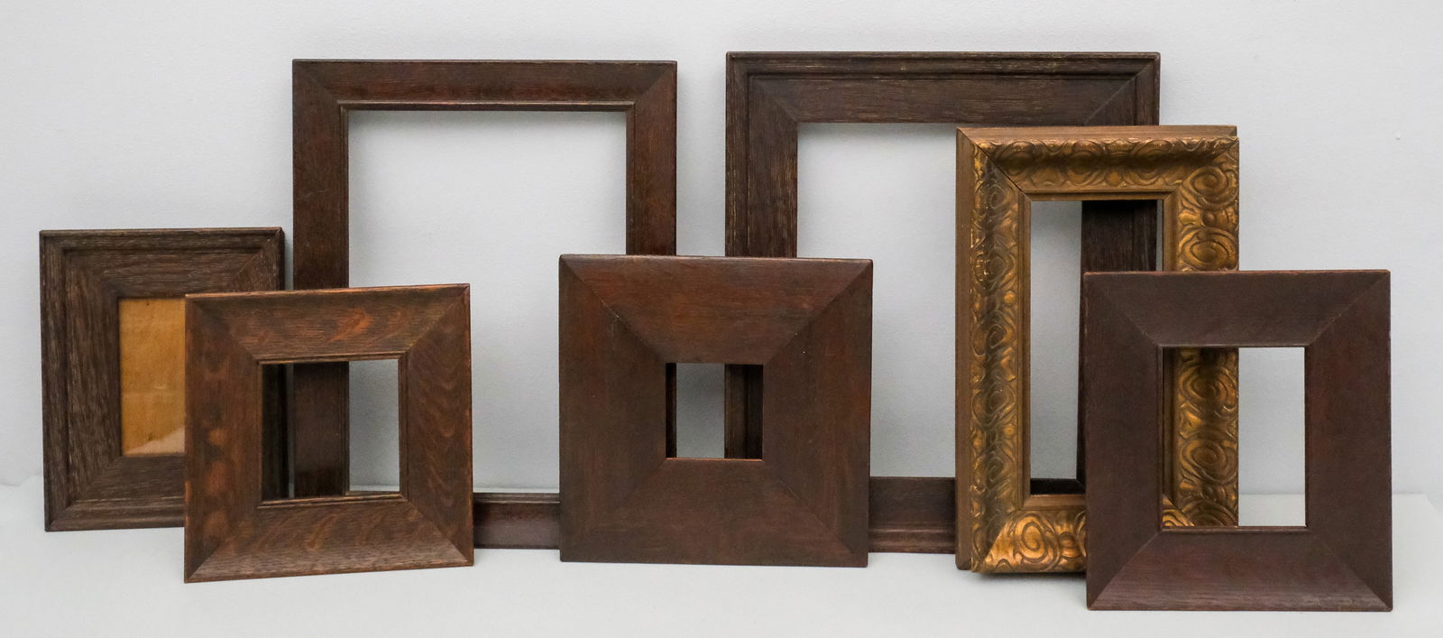 Group of Seven Oak Frames: American, ca. 1890, nice group. Smallest overall 7 1/2" x 7 1/2", rabbet 4" x 4", molding 2", largest overall 11 3/4" x 14", rabbet 8" x 10", molding 2".