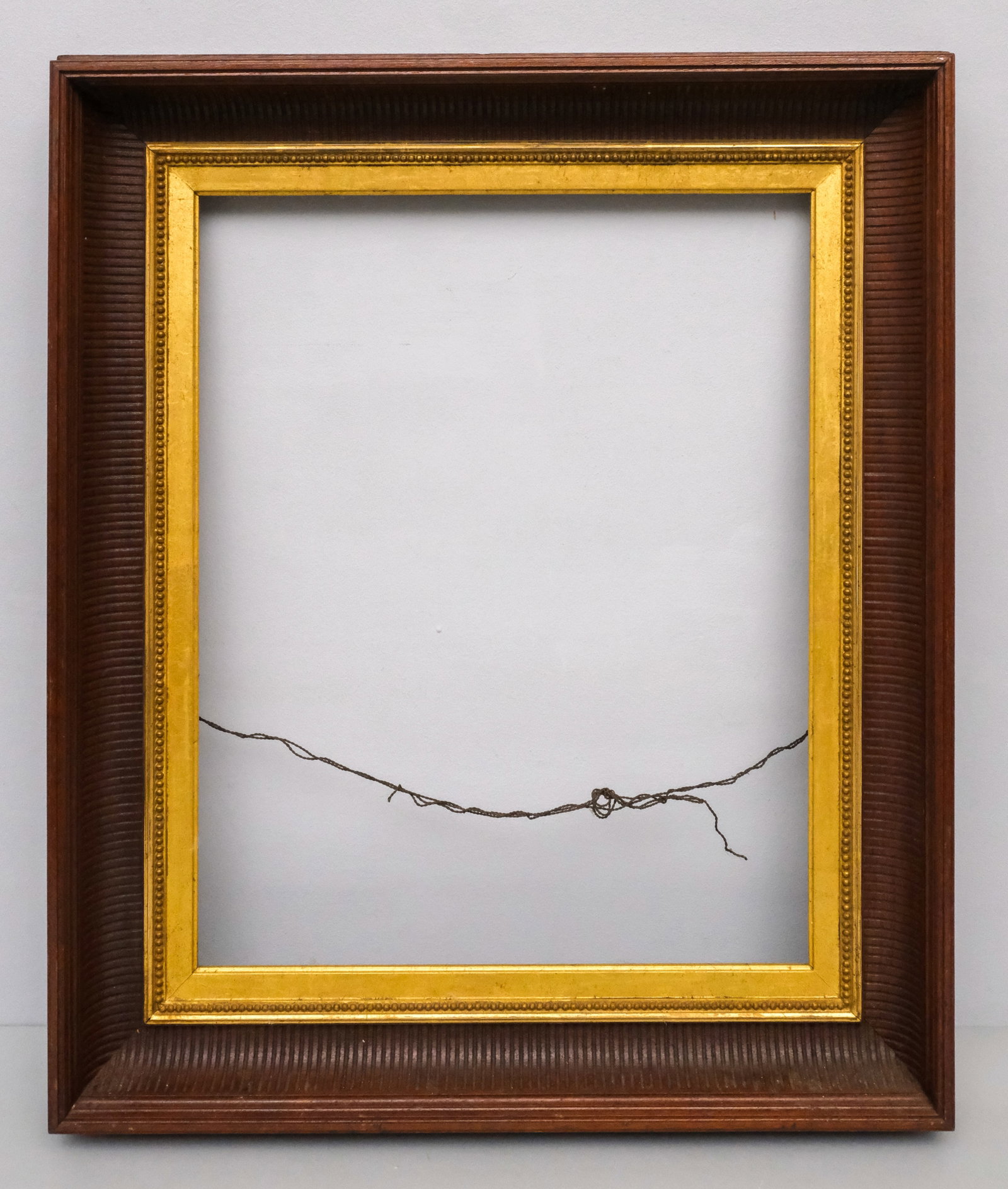 Hudson River School Frame 16" x 20": American, ca. 1860, carved walnut frame having a fluted cove with gilt liner, in a great standard size. Overall 22 1/2" x 26 1/2", Rabbet 16" x 20", Molding 3 1/2".