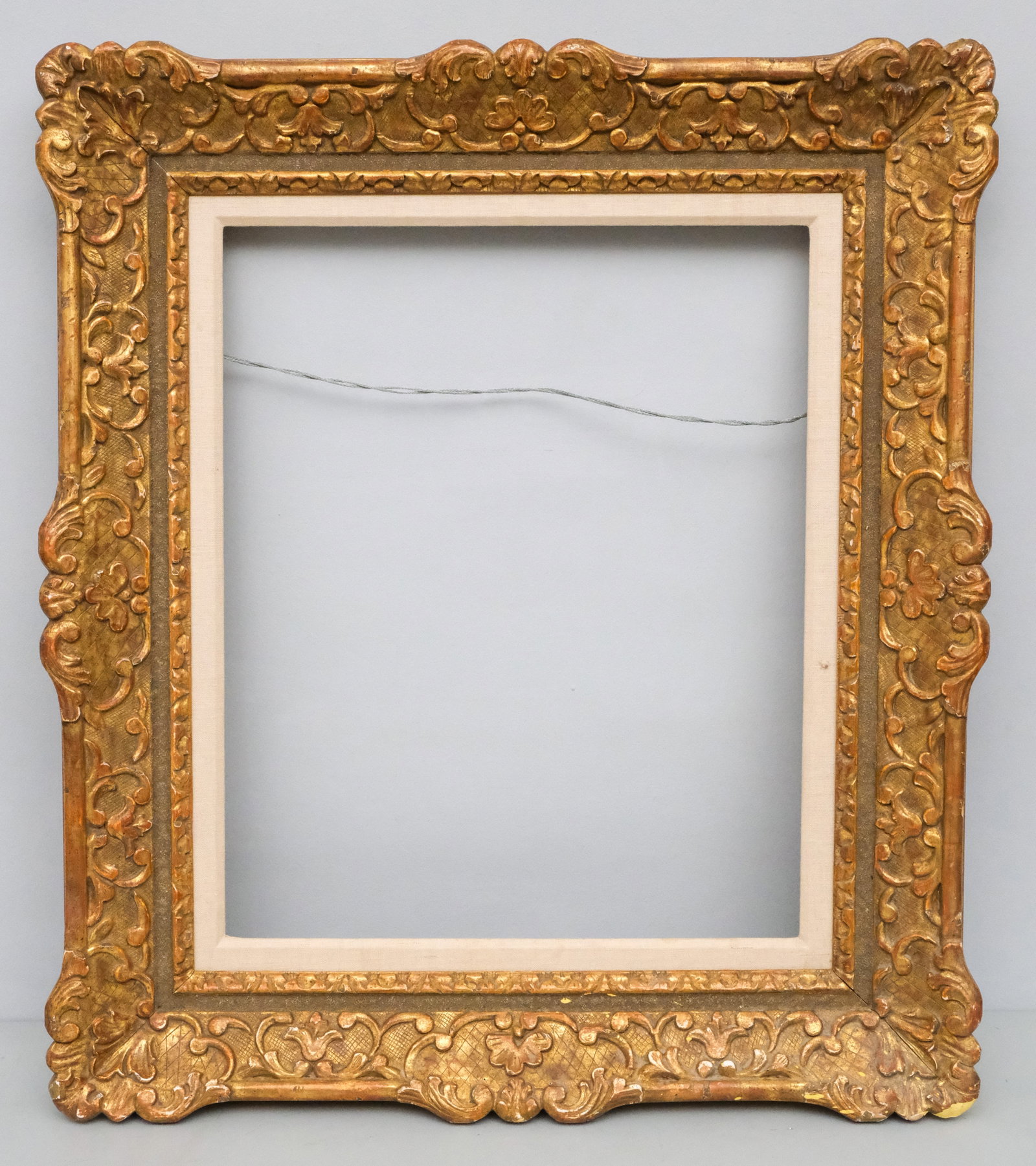 Louis XIV Giltwood Frame 18" x 22": American, 20th century, a very finely wrought custom Louis XIV style carved frame. Overall 27" x 31", rabbet 18" x 22", molding 4 3/4".
