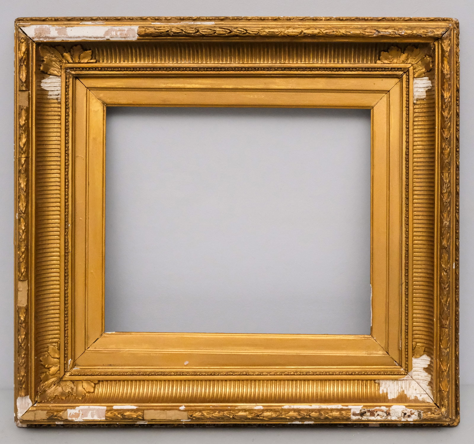 American Fluted Cove Gilt Frame 12" x 14": American, ca. 1860, Hudson River School frame with laurel and berry top edge. Overall 21" x 22 3/4", rabbet 12" x 14", molding 4 3/4".