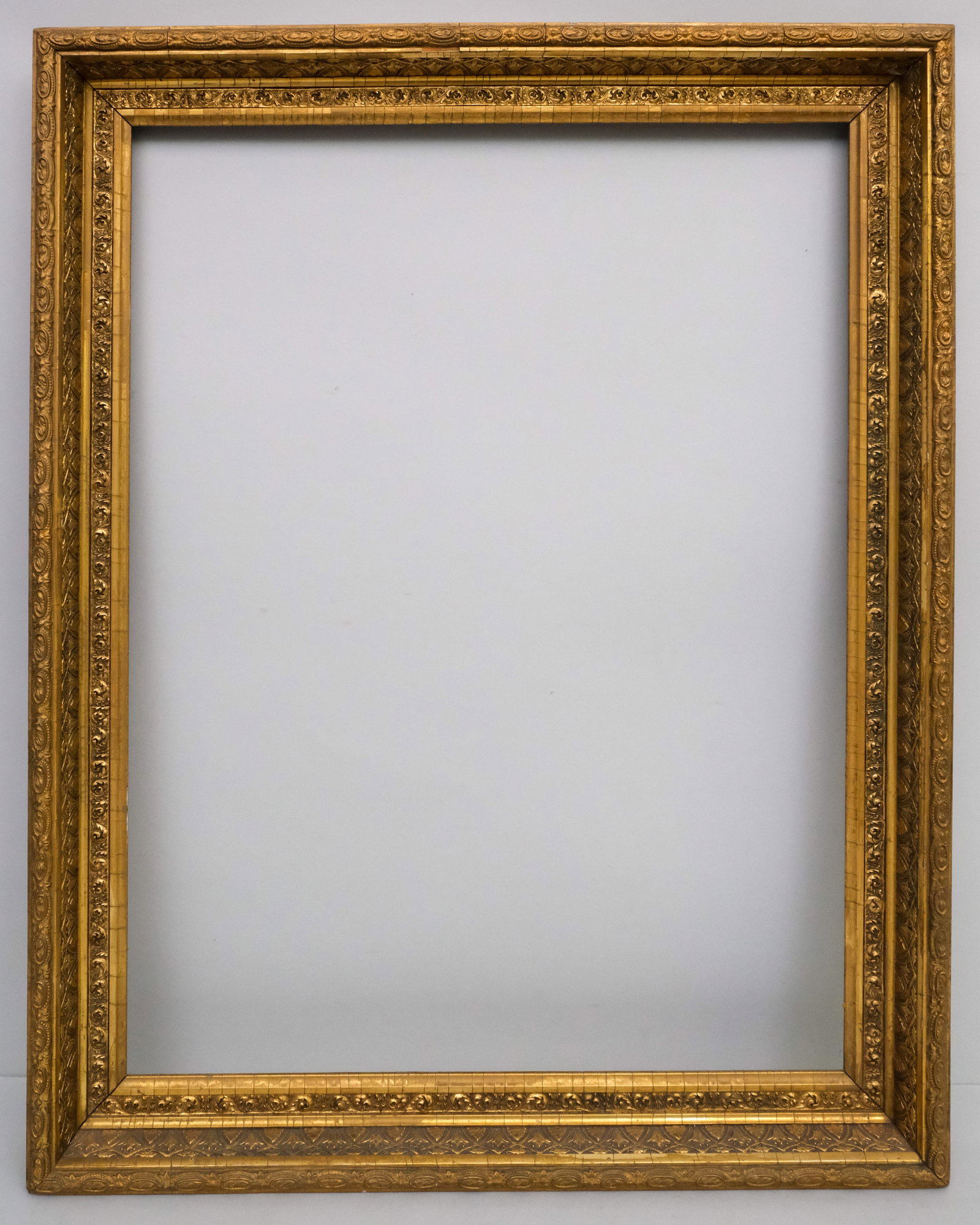 American Hudson River School Frame 20" x 26": American, circa 1880, with an acanthus decorated panel and decorative top edge. Overall 23 3/4" x 30", rabbet 20" x 26", molding 2".